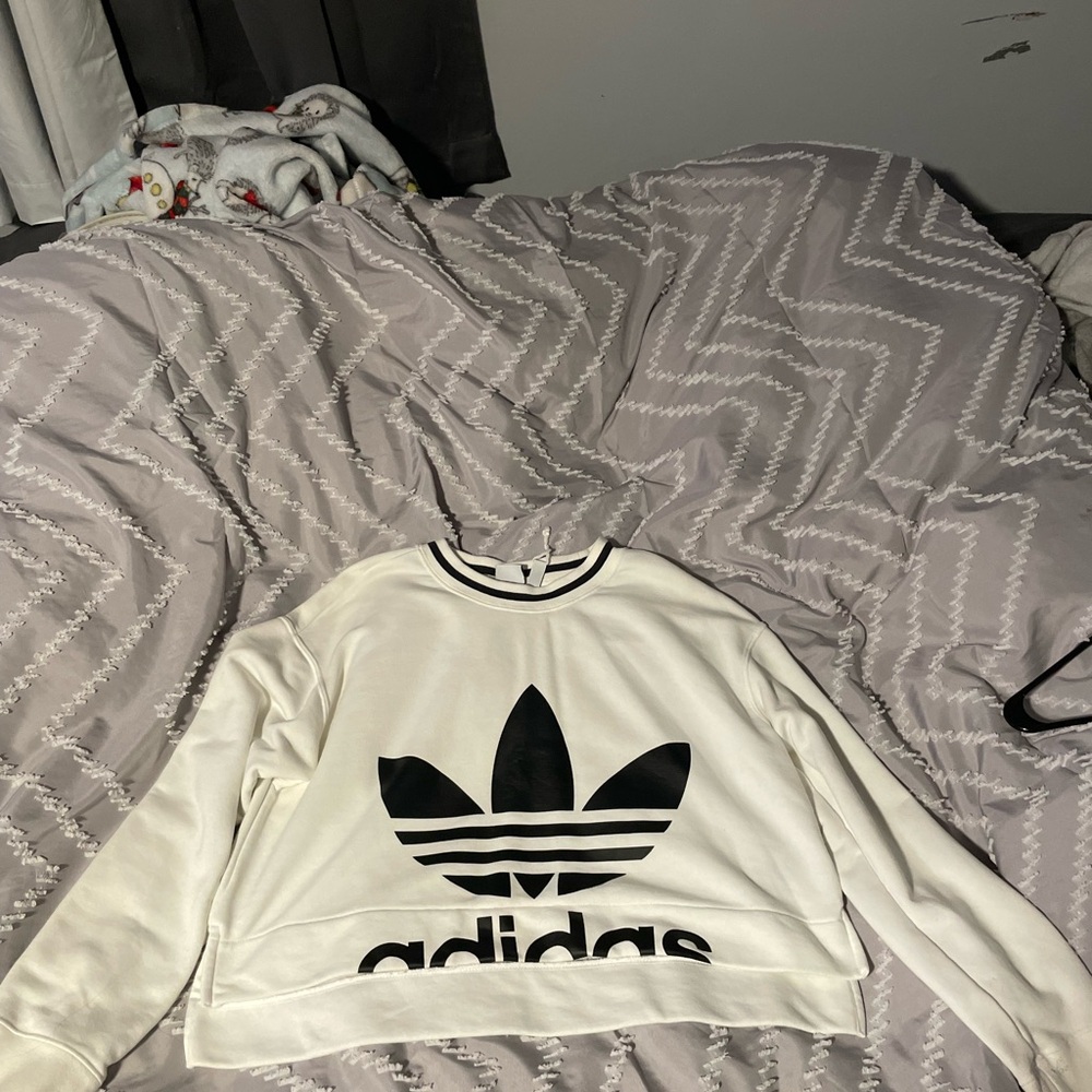 Adidas’s white and black sweatshirt